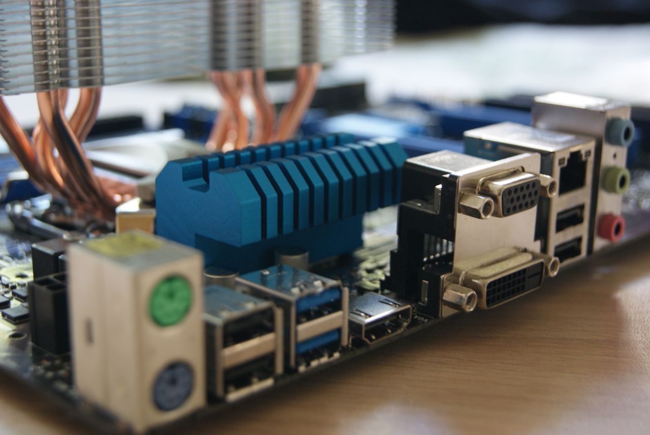 The Art of Drawing Readers In: Your attractive post title goes here Detailed view of computer motherboard with various ports and connectors.