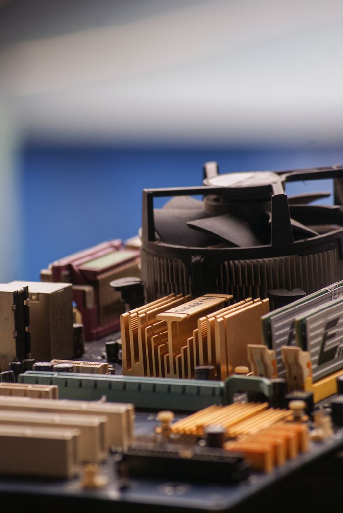 Home Detailed view of various computer motherboard components showcasing tech elements.